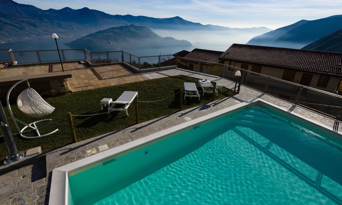 Plassi Apartment | Terrazza a Lago - Dreizimmerwohnung mit Terrasse und Schwimmbad by Interhome