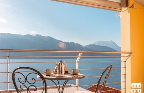 Olcio Apartment | Apartment located on the fourth floor (served by elevator from the garage) of a building facing the lake.The apartment enjoys a 180 degree view of the wonderful Lake Como.The position allows you to enjoy a unique view and feel like you are on the water's