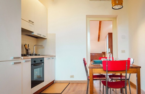 Crescenzago Apartment | Bright attic with wooden beams near public transport