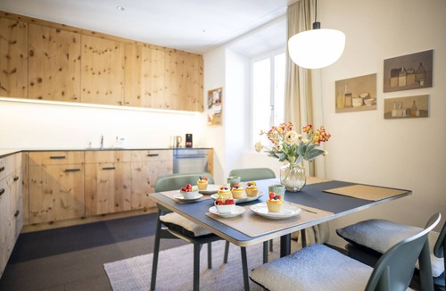Engadin Scoul Apartment | Chasa Stradun 203A – Centrally Located 1-Bedroom Apartment with Balcony and Fireplace in Scuol