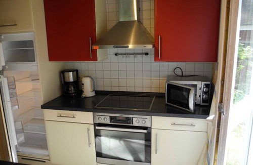 Gohren House | Child-friendly vacation home Hagebutte 263 in Baabe. Awarded the FeWoAirClean seal. Wellness indulgence with a sauna and hot tub. Wooden deck with patio furniture surrounded by nature