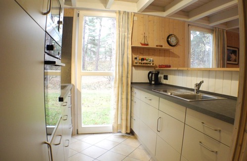 Gohren House | Child-friendly vacation home Dünenwald 281 in Baabe. Cozy living room with a fireplace for relaxing evenings. A relaxing getaway with a sauna and a corner bathtub. The patio and balcony invite you to linger