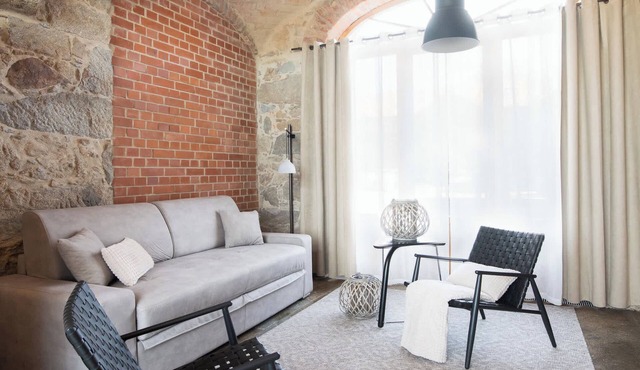 A designer studio beneath historic vaulted ceilings in Großharthau