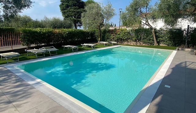 Farfalla Vacation Rental with Air Conditioning, Pool, and Parking Space with a 22-kW Charging Station, 250 Meters from the Lake