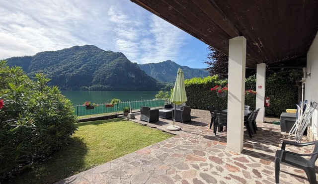 House by the lake with garden