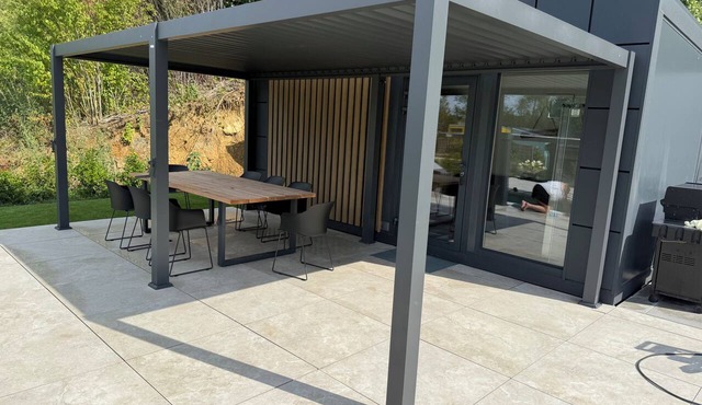 Private wellness lodge on Lake E with air conditioning, a pool, a hot tub, and a sauna in Stadtlauringen