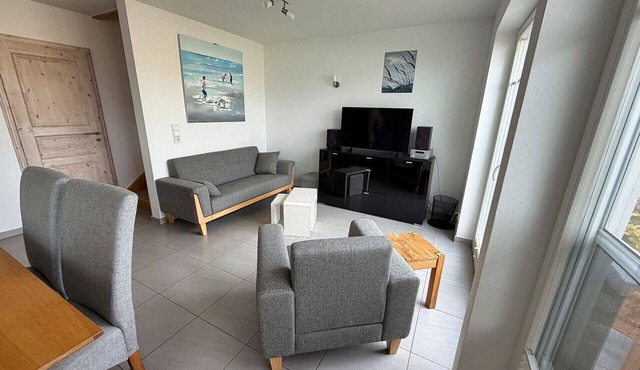 "Strandkorb" Vacation Home in Olpenitz – your own sauna with a view of the sea promises pure relaxation. The spacious terrace is the perfect place to unwind. Board games for all ages provide entertainment. in Olpenitz