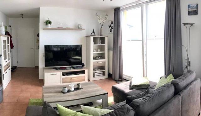 Vacation apartment Strandperle 10 Ostseestern in Großenbrode. Relaxing wellness enjoyment with sauna & whirlpool. Balcony with a unique view of the Baltic Sea. Extensive entertainment for young and old in Großenbrode