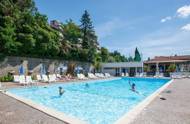 Attractive studio with terrace and garden, pool and dream view in Ghiffa