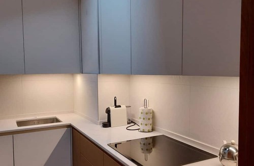 Arona Apartment | Luxury apartment in the heart of Arona, just steps from the lake and just 10 meters from Via Cavour, Arona's main shopping street with boutiques, restaurants, and shops for every need. This beautiful two-room apartment features wood and stoneware floors